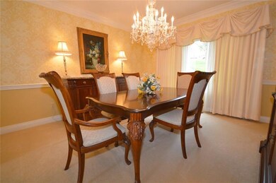 Adjoining the formal living room, the elegant dini