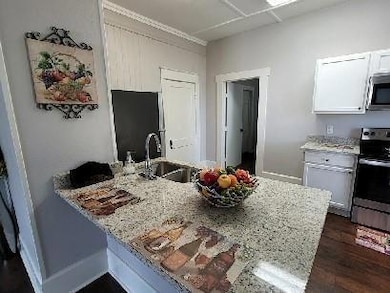 Kitchen featuring a sink, stainless steel applianc