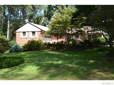 Front of house with beautiful landscaping.