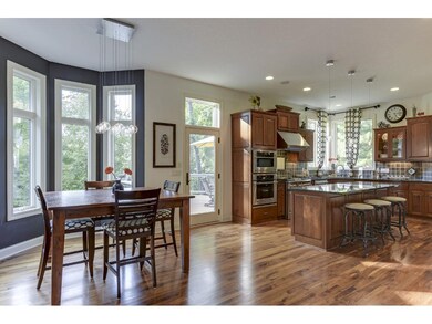 Large eat-in kitchen area with a door leading to t