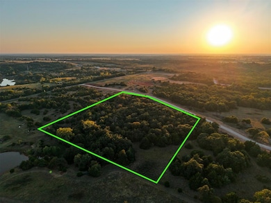 Aerial overview of property's location with property parcel outlined