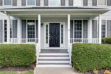 2 STORY CATHEDRAL CEILING ENTRYWAY WITH A COVERED 