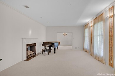 Spacious living room with fireplace, floor to ceil