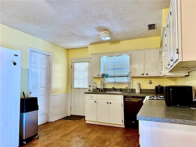 Kitchen with dark hardwood / wood-style floors, wh