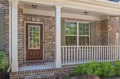 Entrance to property featuring covered porch and b