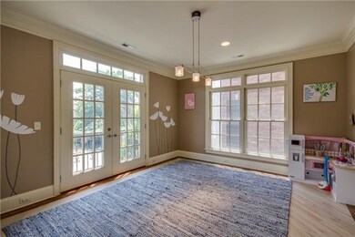 Large dining room is currently being used as a pla