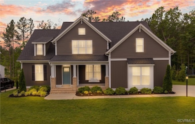 Craftsman inspired home featuring a yard, covered