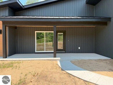 9890 Cushman Ct unit 4, Williamsburg, MI 49690 - photo 4