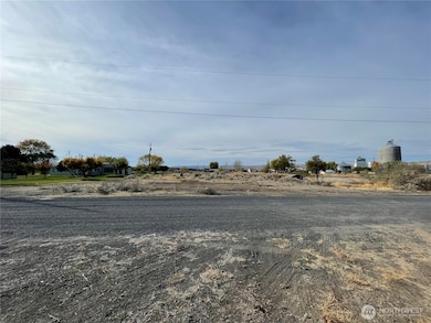 Gravel road to property.  Located on a dead end street.