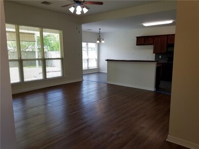 Den from the Foyer leading into the Kitchen with I