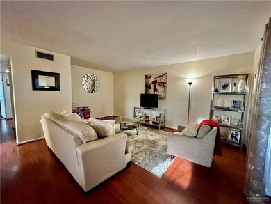 Living room featuring wood finished floors