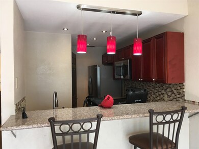 Kitchen featuring tasteful backsplash, appliances