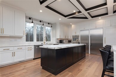 Kitchen with stainless steel appliances, white cab