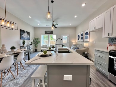Oversized island anchors the kitchen with bar seat