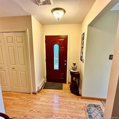 Entryway with light wood-style floors