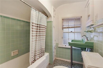 Mint green vintage tile gives this bathroom a thou