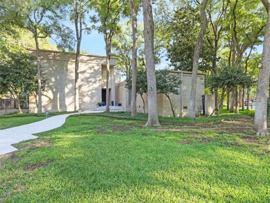 Front entry is on a cul-de-sac with large trees.