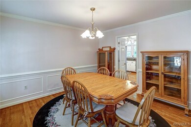 Hardwood foor, chandelier, crown and chair molding