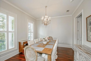 Dining room with plenty of natural light, crown mo