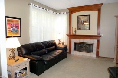 The family room fireplace with a beautiful mantel.