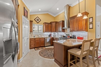 Kitchen featuring lofted ceiling, kitchen peninsul