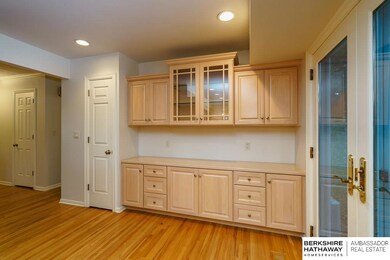 Built-in buffet, cabinetry, pantry.  Newer French Doors open to backyard.