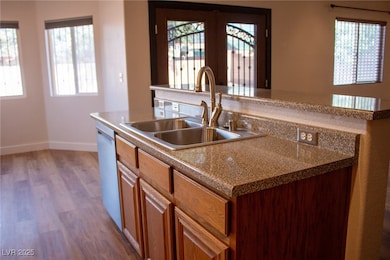 Kitchen featuring a kitchen island with SS sink, h