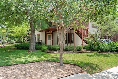 View of front of home featuring a front lawn, sta