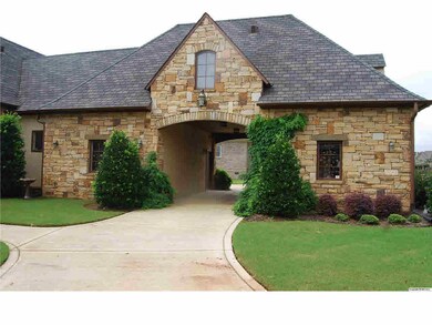 2 car garage and a circular drive that accommodates this covered drive through giving a third parking space.