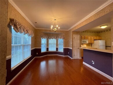 Interior space with ornamental molding, a chandeli