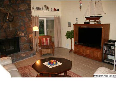 DEN FEATURES HUGE STONE FIREPLACE, TILE FLOOR, 10 