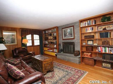 Den. Cozy front den with double sided fireplace, h