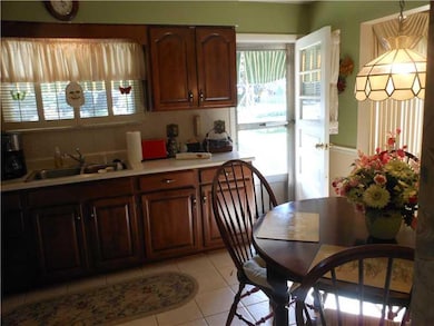 Kitchen. THE KITCHEN HAS A LARGE WINDOW OVER THE S