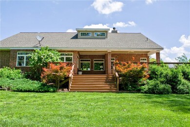 Everything is generous about this home!  Brick exterior and landscaped all around.  The open connection between the back yard, deck, and interior living space make this home a must-see!