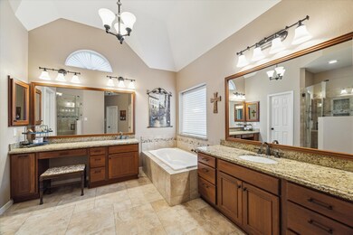 Experience luxury in the primary bath with two lar