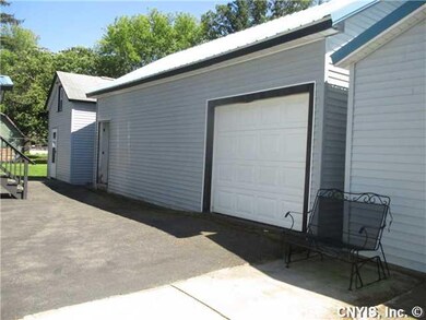 Exterior Front. EXPANSIVE PAVED DRIVEWAYS....THERE