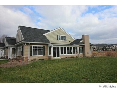 Exterior Front. Side View of Home and Sunroom