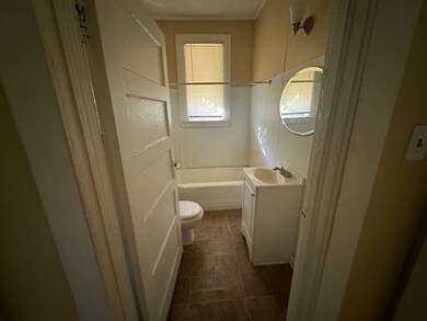 Bathroom featuring tile patterned flooring, vanity