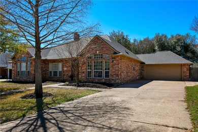 View of front of house featuring a shingled roof,