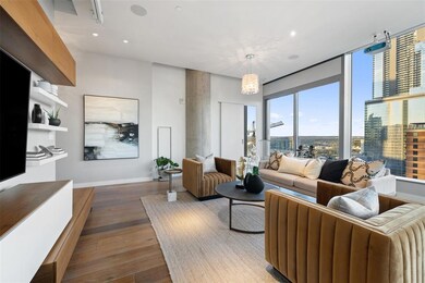 Living area with recessed lighting, baseboards, a