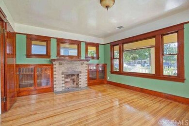 The hardwood floors, wood cabinets and original wo