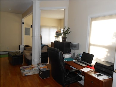 Large open floor plan with hardwood flooring.