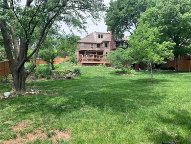 large, lush & landscaped treed yard that is truly 