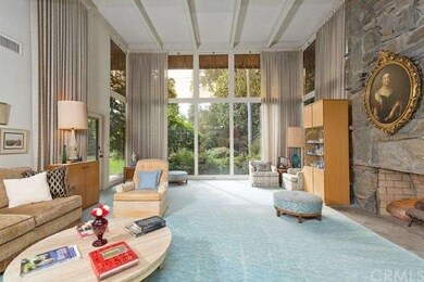 Dramatic 2 story Living room looking out to view