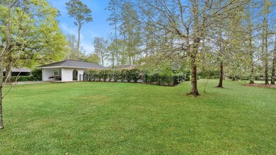 View of rear of home , iron fencing around pool an