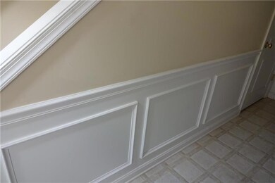 lower level family room opens to a private back ya