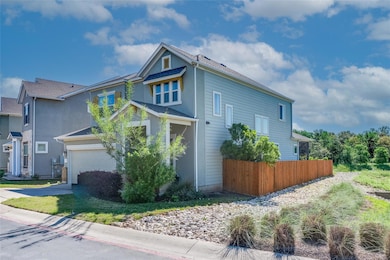 View of home's exterior with concrete driveway, s
