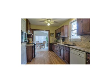 Updated kitchen looking toward family room
