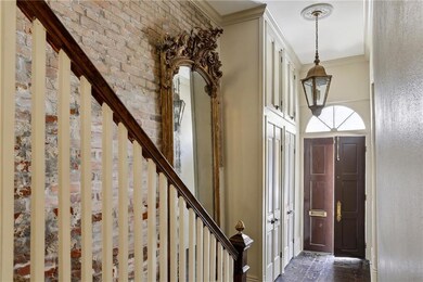 Built in 1843, this home welcomes you through an enchanting entrance featuring a striking gilded mirror