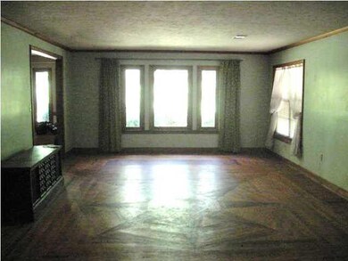 FORMAL LIVING ROOM WITH HARDWOOD FLOORS